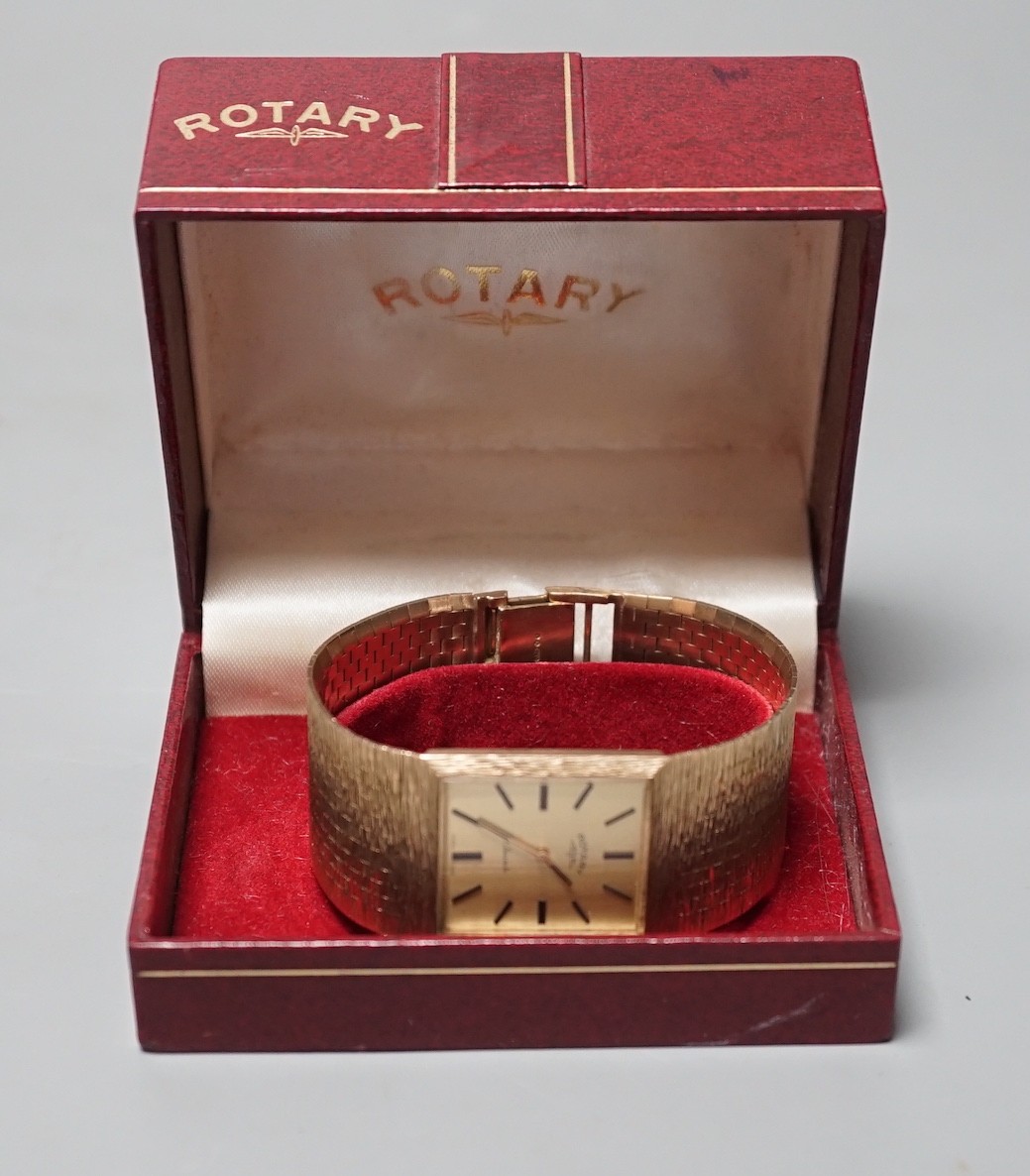 A gentleman's early 1970's textured 9ct gold Rotary manual wind dress wrist watch, with baton numerals, gross weight 67 grams, with Rotary box.